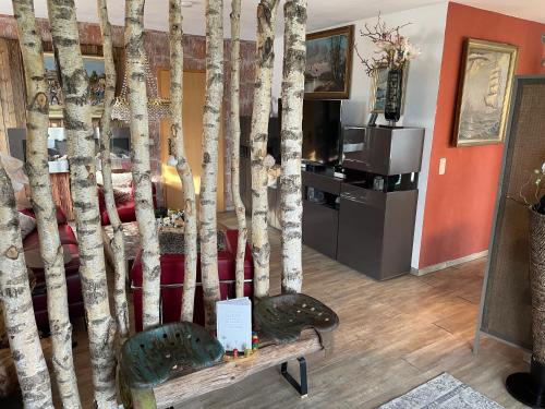 a bedroom with a bed with trees on it at Luckylake in Muhr amSee
