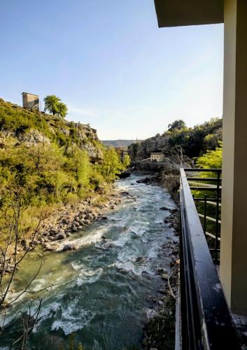a view of a river from a balcony at Hotel Casa Peix in Serraduy