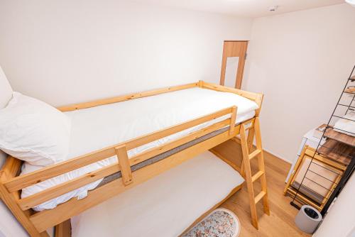 a bedroom with two bunk beds in a room at Kamakura no Nikki in Kamakura
