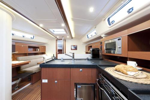 a kitchen with a sink and a counter top at ''Alkyoni" Sailing Yacht in Thessaloniki