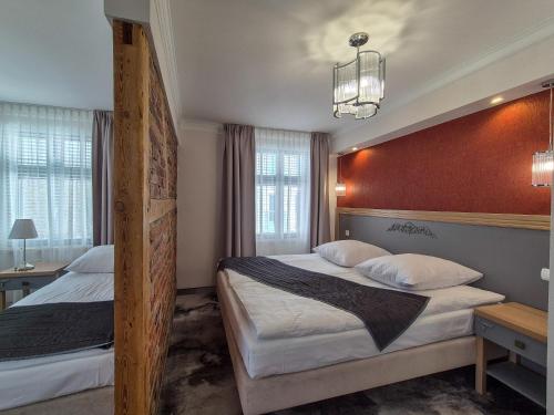 Ein Bett oder Betten in einem Zimmer der Unterkunft Monaco Ville Wellness