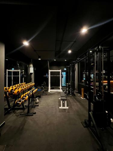 a gym with rows of chairs in a room at Dark Lights Retreat in Na Jomtien