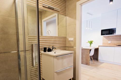 TV a/nebo společenská místnost v ubytování Apartamenty Baltic Sea Maczka 13