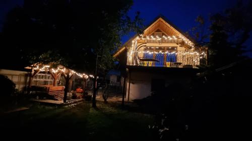 a house lit up at night with lights at Apartmánovy dom Daniela in Prievidza