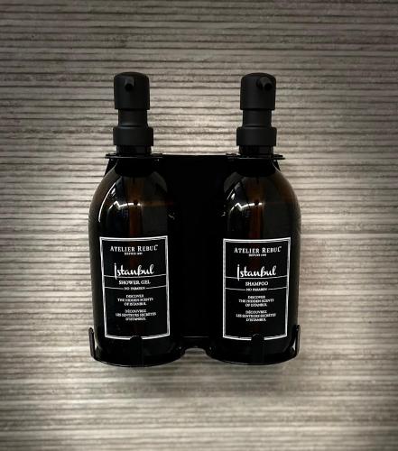 two bottles of honey sitting on top of a table at Garden Street Lommel - The Green Haven in Lommel