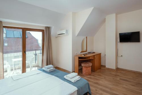 Postel nebo postele na pokoji v ubytování Hotel Milan