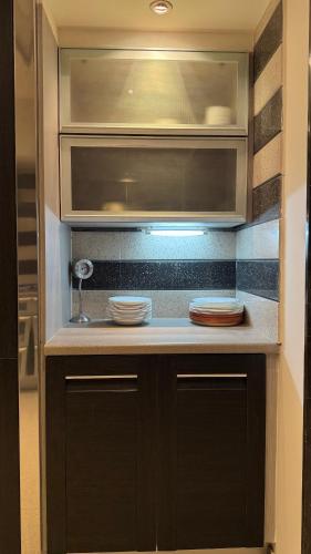 a kitchen with a counter with two plates on it at Golf View Islamabad in Islamabad