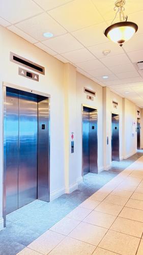 a row of elevator doors in a building at Breathtaking OCEAN FRONT Condo in Daytona Beach in Daytona Beach