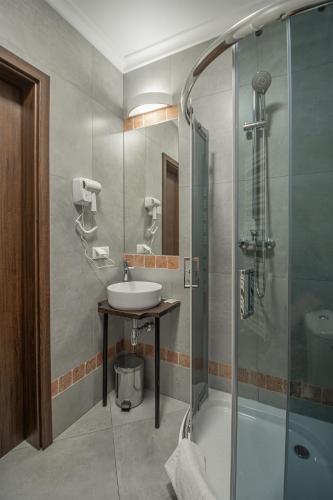a bathroom with a sink and a shower at Soul Rooms Old Town Gdansk in Gdańsk