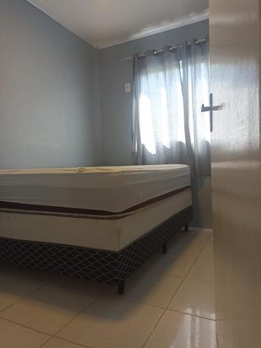 Postel nebo postele na pokoji v ubytování Casa com ar condicionado