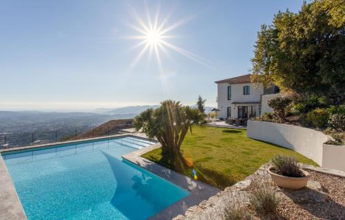 a villa with a swimming pool and a garden at Maison Saint Christophe in Grasse