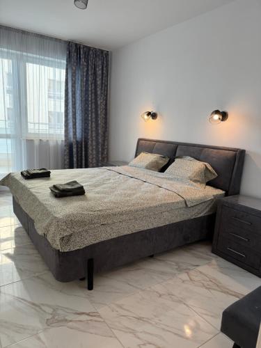 a bedroom with a large bed in a room at Central Park 7 in Burgas City