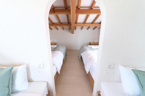 LugStay Retreat 琵琶湖にあるベッド