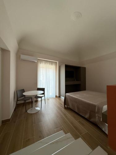 En eller flere senge i et værelse på Umbrella House