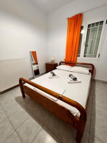 a bedroom with a bed with a phone on it at Παραθαλάσσια Κατοικία Στον Άγιο Μερκούριο Ευβοίας in Mourteri