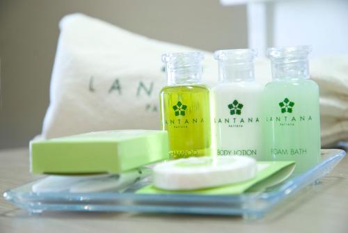two bottles of essential oils and soap on a table at Lantana Pattaya - SHA Extra Plus in Pattaya North