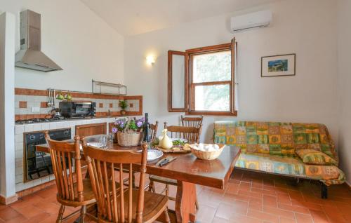 a kitchen and living room with a table and a couch at Gorgeous Home In Sedini With Wifi in Sedini