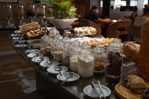 a buffet with many different types of food on a table at Blue Sunset Beira Mar in João Pessoa