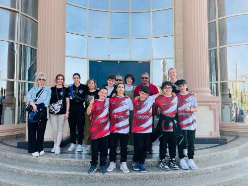a group of people standing in front of a building at Ramage Hotel & Resort in Cairo