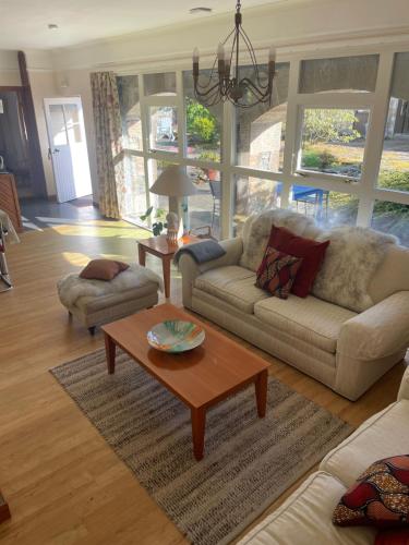 a living room with two couches and a coffee table at The Steading at Barmore in Tarbert