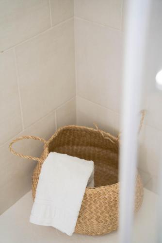 a bathroom with two baskets of towels on a counter at Blumarine Residence Club in Ostuni