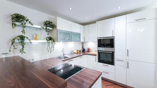 Kuchyň nebo kuchyňský kout v ubytování TEMPORA Homes - Serviced Apartments Neuwaldegg