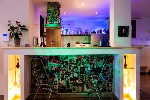 a bar in a room with a green counter top at Villa Panorama Pool & Garden in Trevignano Romano