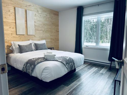 Ένα ή περισσότερα κρεβάτια σε δωμάτιο στο Cottage Quebec - La Nepheline
