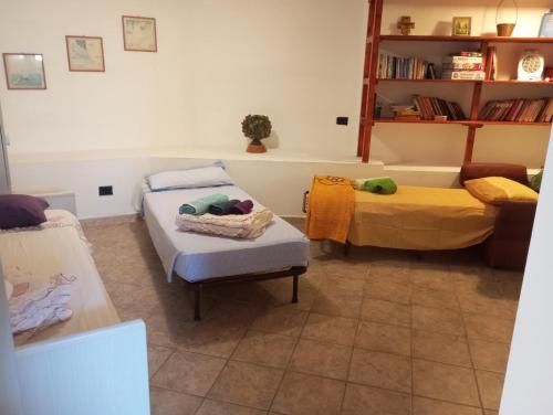 a living room with two beds and a couch at SA FraDa in Olmedo