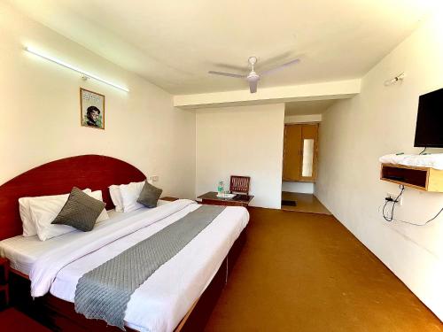 Cama o camas de una habitación en Hotel Lilly Inn Himalayan Snow views