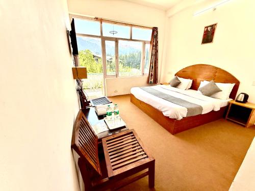 Cama o camas de una habitación en Hotel Lilly Inn Himalayan Snow views
