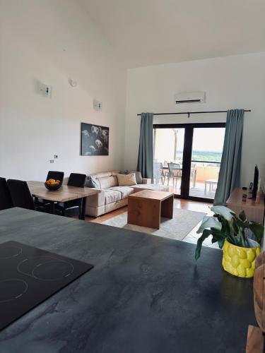 a living room with a couch and a table at Casa Lara in Kaštelir