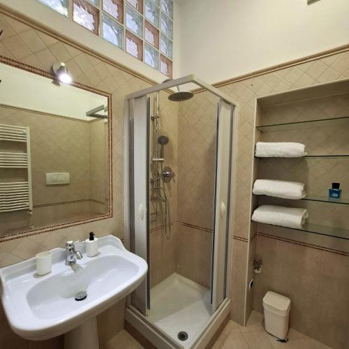 a bathroom with a sink and a shower at Domus Nicolaus in Giovinazzo