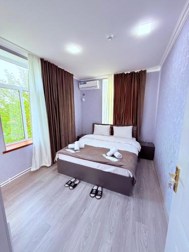 Ένα ή περισσότερα κρεβάτια σε δωμάτιο στο Elit Hostel Qabala
