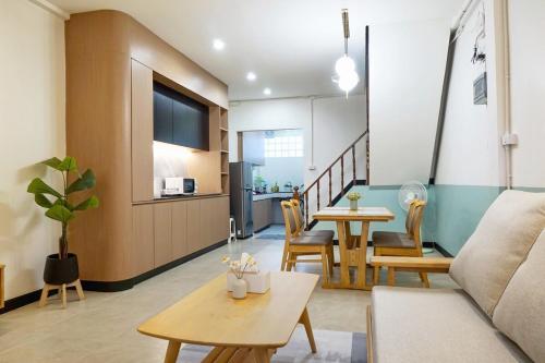a living room with a couch and a table at Entire house 2 Bedrooms 120 square meter in Chiang Mai