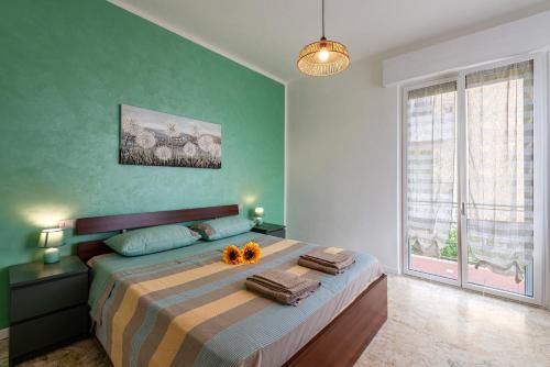 En eller flere senge i et værelse på Conero Holiday Home - "Il Girasole"