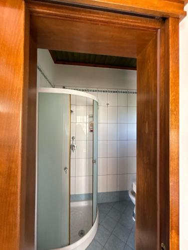 a bathroom with a shower and a toilet at Holiday Home Zenit in Ulcinj