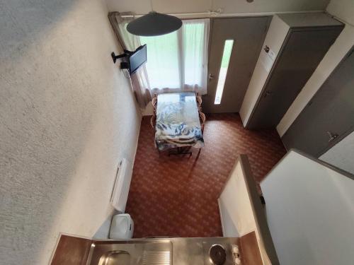 an overhead view of a room with a chair and a sink at Village Bord de Ciel in Caylus