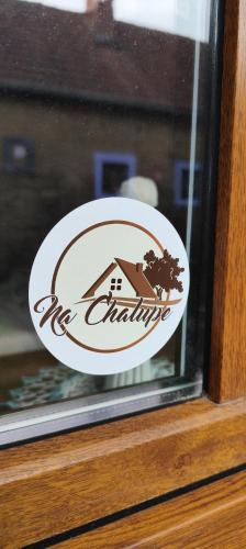 a sticker on a glass window of a house at Chalupa u Holoubků in Hrubá Vrbka
