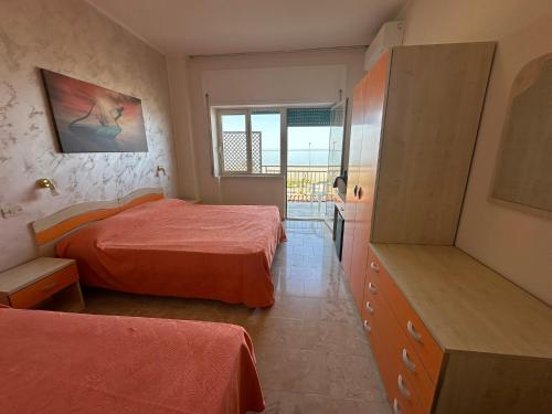 Postel nebo postele na pokoji v ubytování Hotel Germania