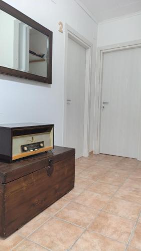 a room with a dresser and a mirror on the wall at La Quiete in Montenero di Bisaccia