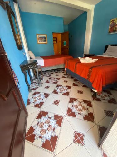 Una cama o camas en una habitación de Gutierrez Hotel