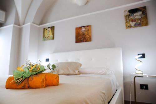 a bedroom with a bed with two pumpkins on it at Dante 25 in Triggiano