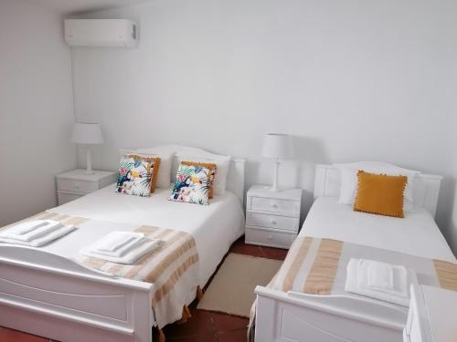 Postel nebo postele na pokoji v ubytování A Casa da Carolina
