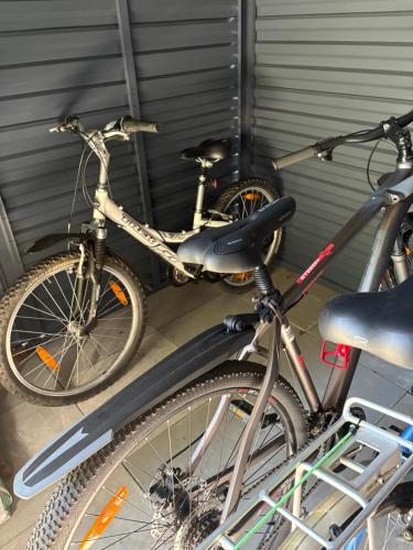 two bikes parked next to each other in a garage at Domek Marzenie in Radawa