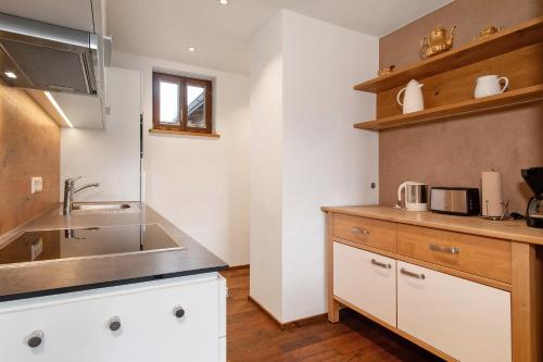 a kitchen with a sink and a counter at Obst- und Ferienhof Lehle in Immenstaad am Bodensee
