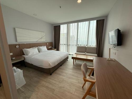 Ένα ή περισσότερα κρεβάτια σε δωμάτιο στο Empire Damansara Hotel Room