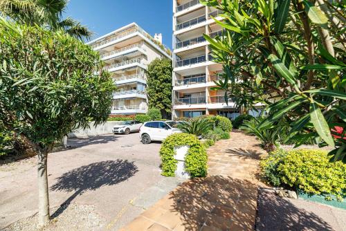 a parking lot in front of a apartment building at Emilie - panoramic sea views beach facing paradise in Vallauris