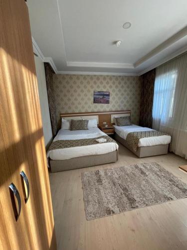 Postel nebo postele na pokoji v ubytování Dimet Park Hotel