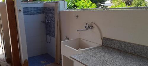 a bathroom with a shower and a bath tub at Villino Il melograno in Torre Specchia Ruggeri